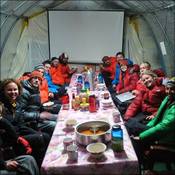 Base Camp team enjoying dinner in the mess tent